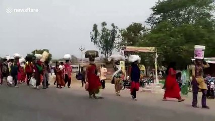 Migrant workers travel hundreds of miles on foot to reach home amid COVID-19 lockdown in southern India