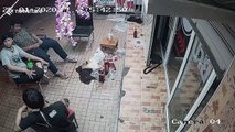 Shocking moment 'drunk driver' smashes through shop injuring three men sitting outside