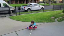 Father Helps Son Skateboard at Home During Quarantine