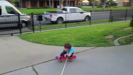 Father Helps Son Skateboard at Home During Quarantine