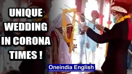 A unique wedding in Madhya Pradesh's Dhar: 'Varmala' with 'do gaj doori' : Watch | Oneindia News