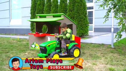 Artem and Mom play with kids toy cars and assembling Lego tower