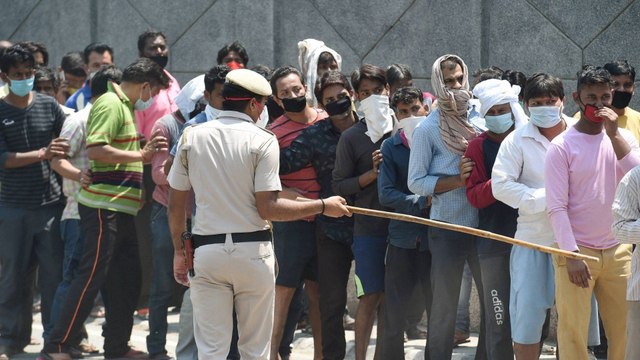 Police teaching social distancing norms outside liquor store