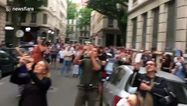 Saxophone player entertains neighbours in France as fireman dance on cherry picker next to his balcony