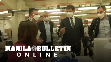 French interior minister visits mask factory
