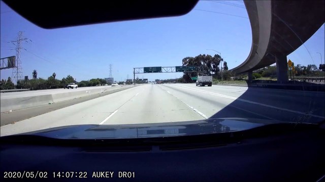 Car Swerves Straight Into the Side of a Dump Truck