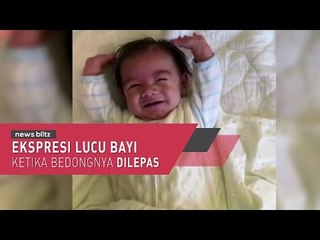 Ekspresi Lucu Bayi Ketika Bedongnya Dilepas