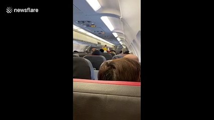 Footage shows packed American Airlines flight during COVID-19 pandemic