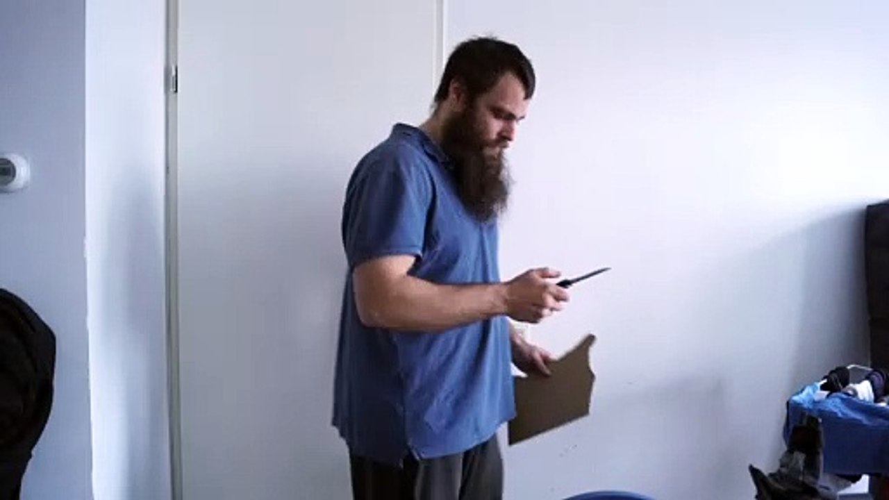 A black, Tac-Force stainless steel folding knife test