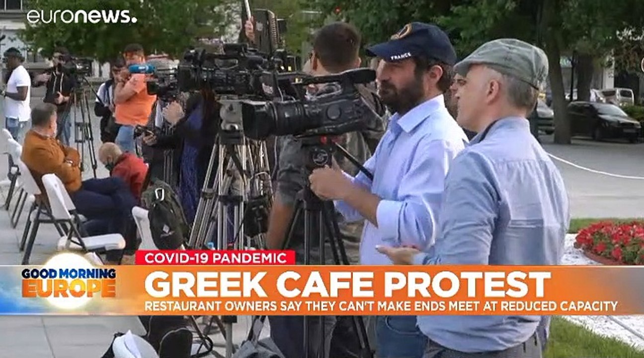 Coronavirus: Greek restaurateurs' empty chairs protest over social distancing plan