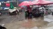 Tropical storm batters market in northern Thailand as temperatures hit 40C