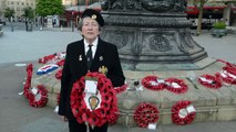 Pat Davey lays a wreath at Sheffield War memorial to mark VE Day
