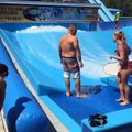 Guy Loses Balance on Wave Machine