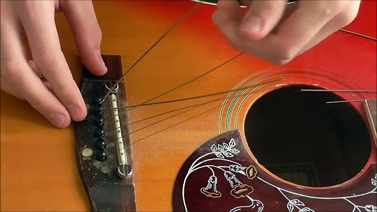 How to Restring an Acoustic Guitar (For Beginners)