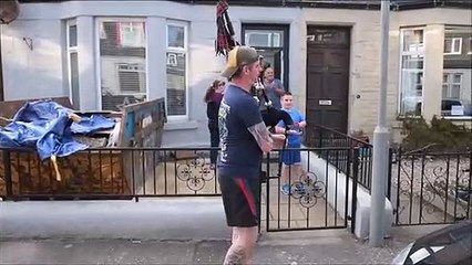 Mungalhead Road clapping for essential workers with bagpiping from Evan and Fergus