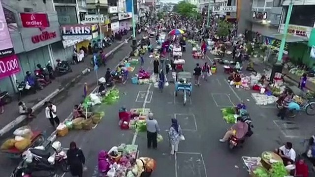 Masks and no touching: Indonesia aims to keep markets alive