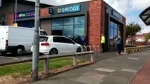 Queues begin to form outside Greggs's branch near The Broadway, Sunderland, as the High Street giant begins to reopen its stores.