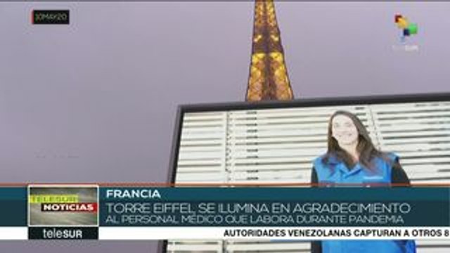 Iluminan la torre Eiffel en homenaje al personal médico