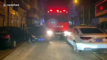 Chinese residents flip car onto its side to clear path for fire engine