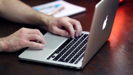 Person Working on an Apple MacBook