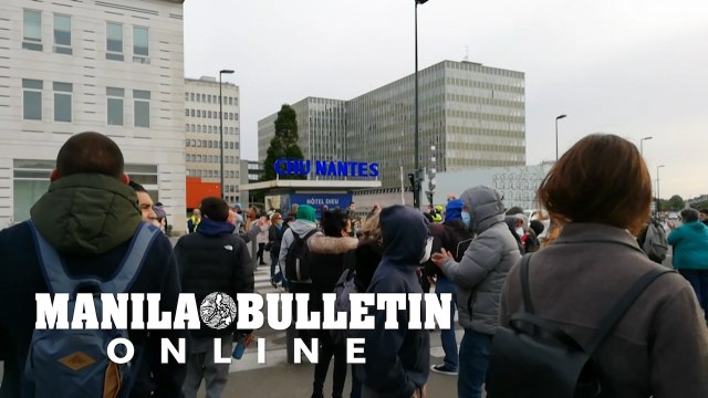 Hundreds protest outside French hospital over virus response