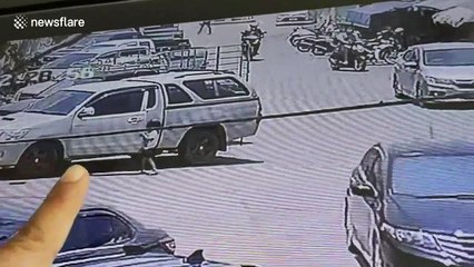 Heart-stopping moment Thai girl runs into road as motorbike rider narrowly avoids smashing into her