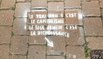 Des tags contre le consumérisme dans les rues de Namur