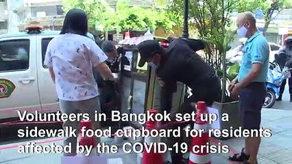 Food cupboards on Bangkok's sidewalks offer relief