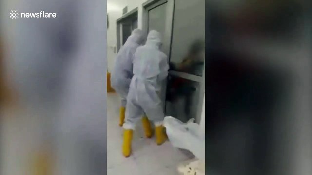 Terrifying moment furious coronavirus patient breaks out of isolation ward in Indonesia