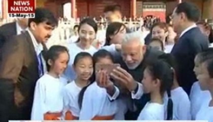PM Modi Shares Heartwarming Selfies with Children at Beijing Yoga Event 🇨🇳