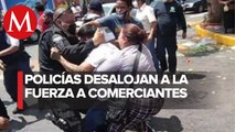 Policías y comerciantes se enfrentan en Tlalnepantla