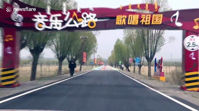 Musical road in China plays patriotic song when cars drive over