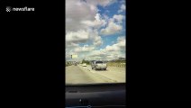 Reportedly distracted truck driver hits a car on California highway