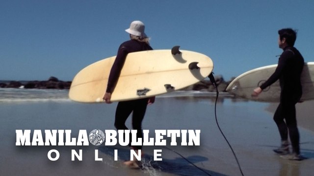 Small numbers of surfers return to Venice Beach as it reopens in California