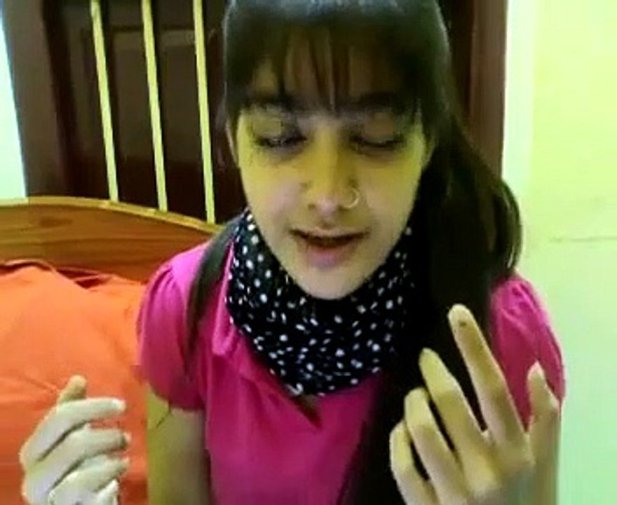 A Very Cute Pakistani Girl singing a song