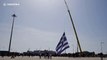 'Largest Greek flag ever' hoisted into position with crane near Turkey border