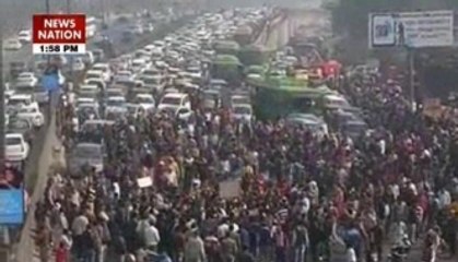 Sanitation workers block roads in Delhi