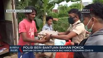 Polisi Beri Bantuan 200 Paket Bahan Pokok Bagi Warga Terdampak Covid-19