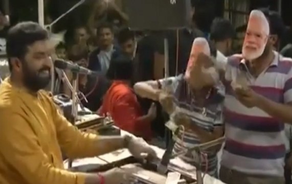 Cash showered on stage while Gujarati singer Geeta Rabari performs