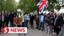 Scuffles as police lead away anti-lockdown protesters in London