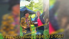 Vancouver supermarket manager reviews pixel precise heat-seeking thermal imaging fever screening system after her cashiers and supervisors are tested, Surrey BC, Metro Vancouver, Canada, while obeying the two meter physical distancing guideline
