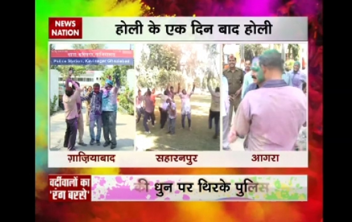 Police personnel celebrate Holi