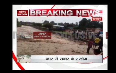 Dehradun: 2 People rescued after car gets swept away during flood