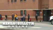 People line up for food handouts in New York