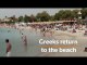 Greek beaches open with chained umbrellas and chairs spaced apart