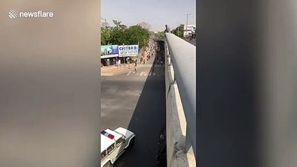 Migrant workers pelt stones during clash with police in western India