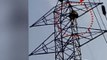 A man in Chennai climbs atop high tension electric pole after not getting change of Rs 2000 note