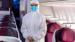 Qatar Airways' Flight Attendants Will Wear Full PPE Suits Starting Monday
