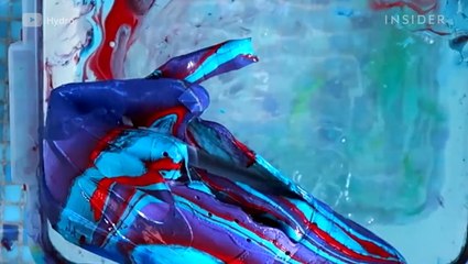Watch this artist hydro dip sneakers into colorful paints