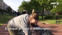Protesters stage mock funeral procession with 'body bags' outside White House